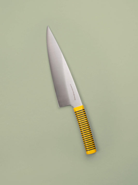 Handcrafted in Barcelona, this chef knife blends high-carbon steel and stacked handle for balance, control, and precision. Perfect for daily prep.