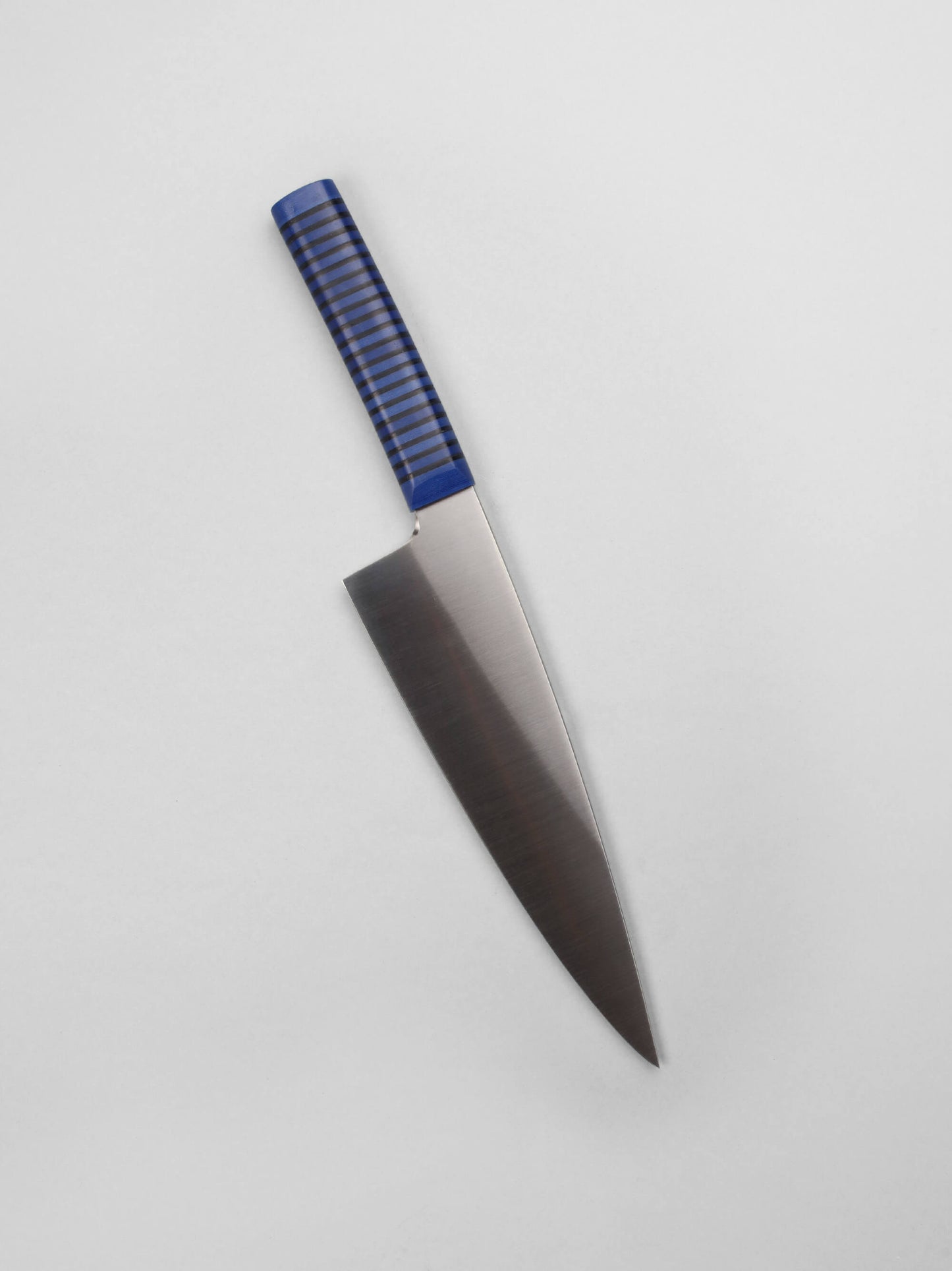 Handcrafted in Barcelona, this chef knife blends high-carbon steel and stacked handle for balance, control, and precision. Perfect for daily prep.