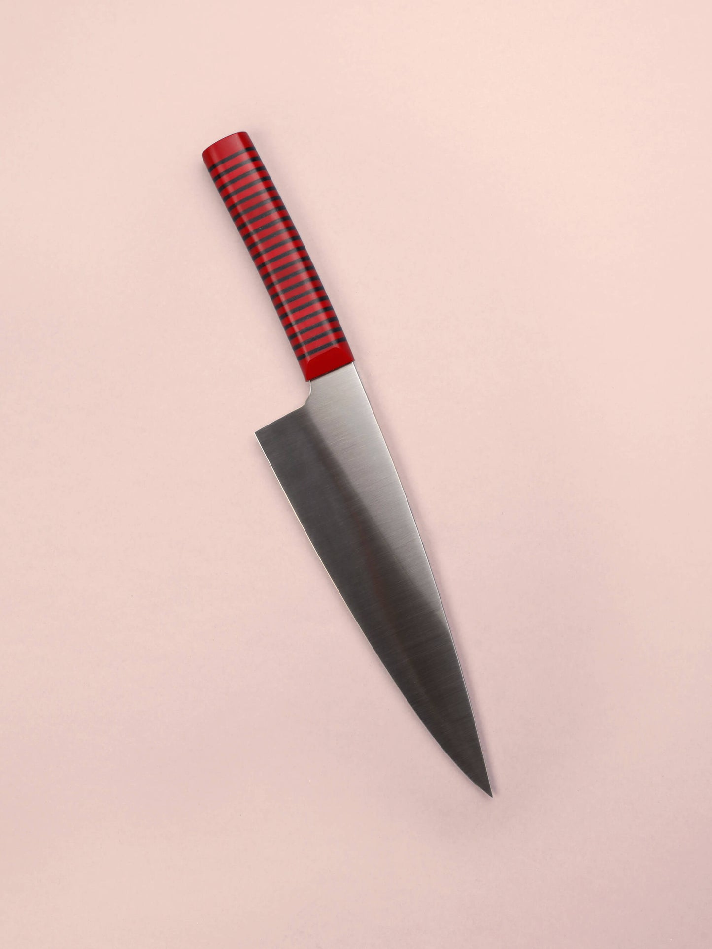 Handcrafted in Barcelona, this chef knife blends high-carbon steel and stacked handle for balance, control, and precision. Perfect for daily prep.